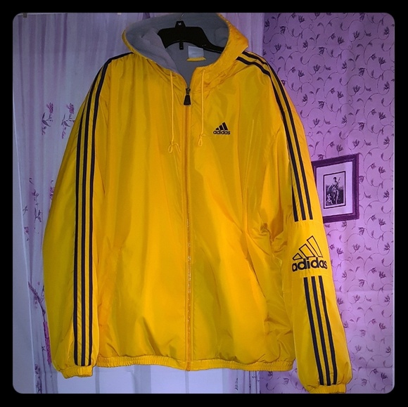 black adidas jacket with yellow stripes